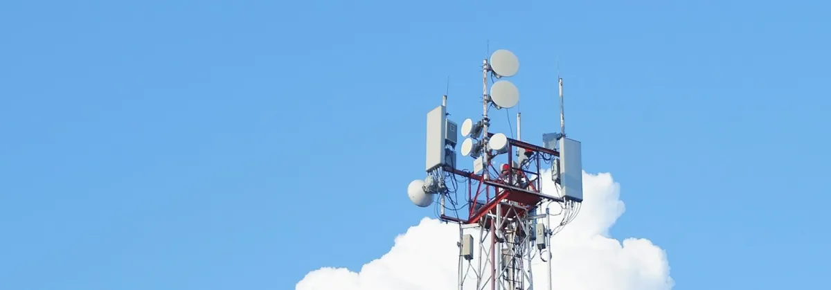 Be your own Telco - A mobile mast against a blue sky background
