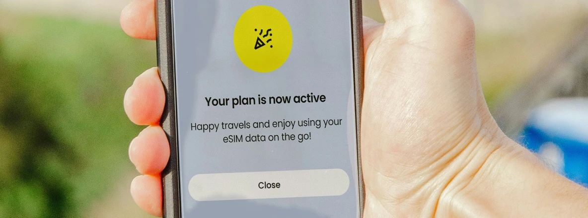 MVNEs and Personalized Connectivity - A person using an MVNO powered app to purchase an eSIM