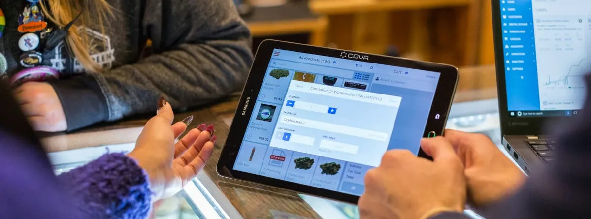 Customer Choice in IoT - people discussing business around a tablet on a desk