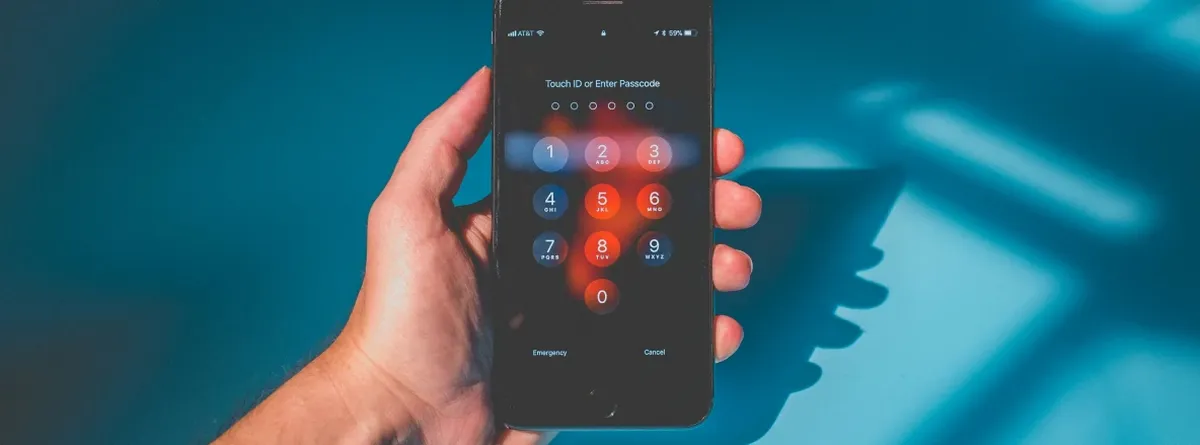 From QR Codes to Invisible Activation: hand holding a mobile phone against a blue background