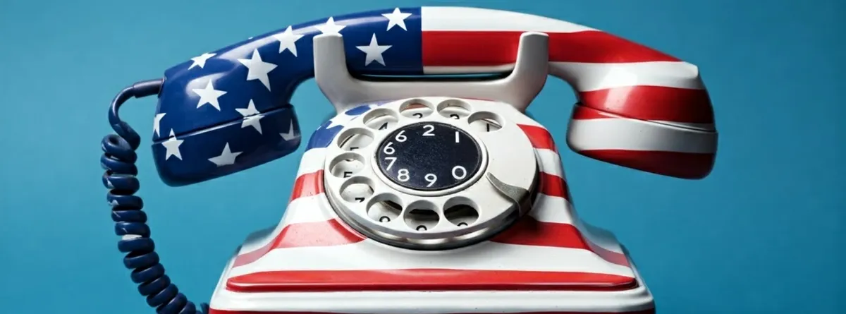 An old-style rotary phone in American flag colors