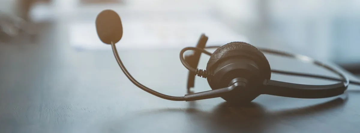 Closeup of a calling headset on a desk