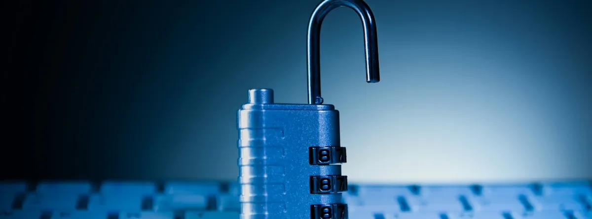 eIM for IoT - an unlocked padlock sitting on top of a keyboard