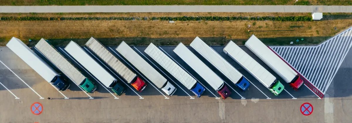 SGP.32 Lifecycle - Aerial view of a row of parked trucks