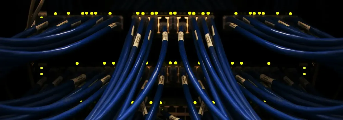 Cables in a a server room, possibly in a cloud data center