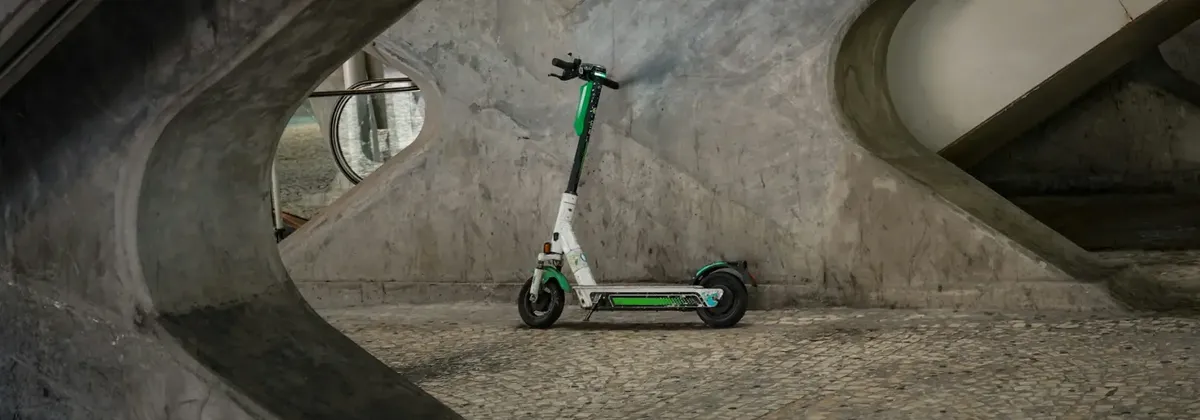 IoT Connectivity - A micromobility e-scooter parked under a bridge