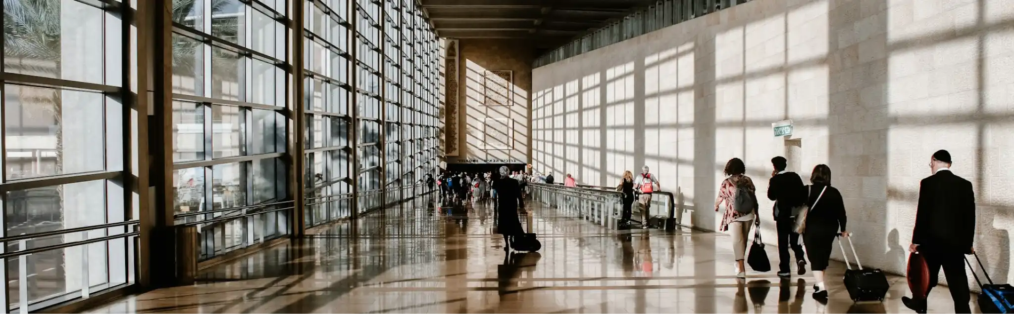 Business travelers walking through an airport terminal