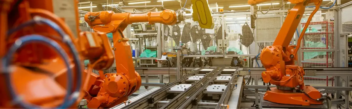 IoT devices in a factory, one area where mobile industry emissions must fall
