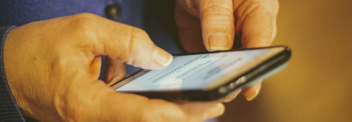 Device Intelligence in IoT - a person using a mobile phone with device intelligence