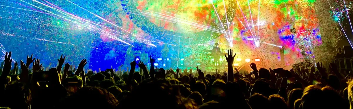 A crowd watching Tame Impala at a music festival, a key location for IoT technology