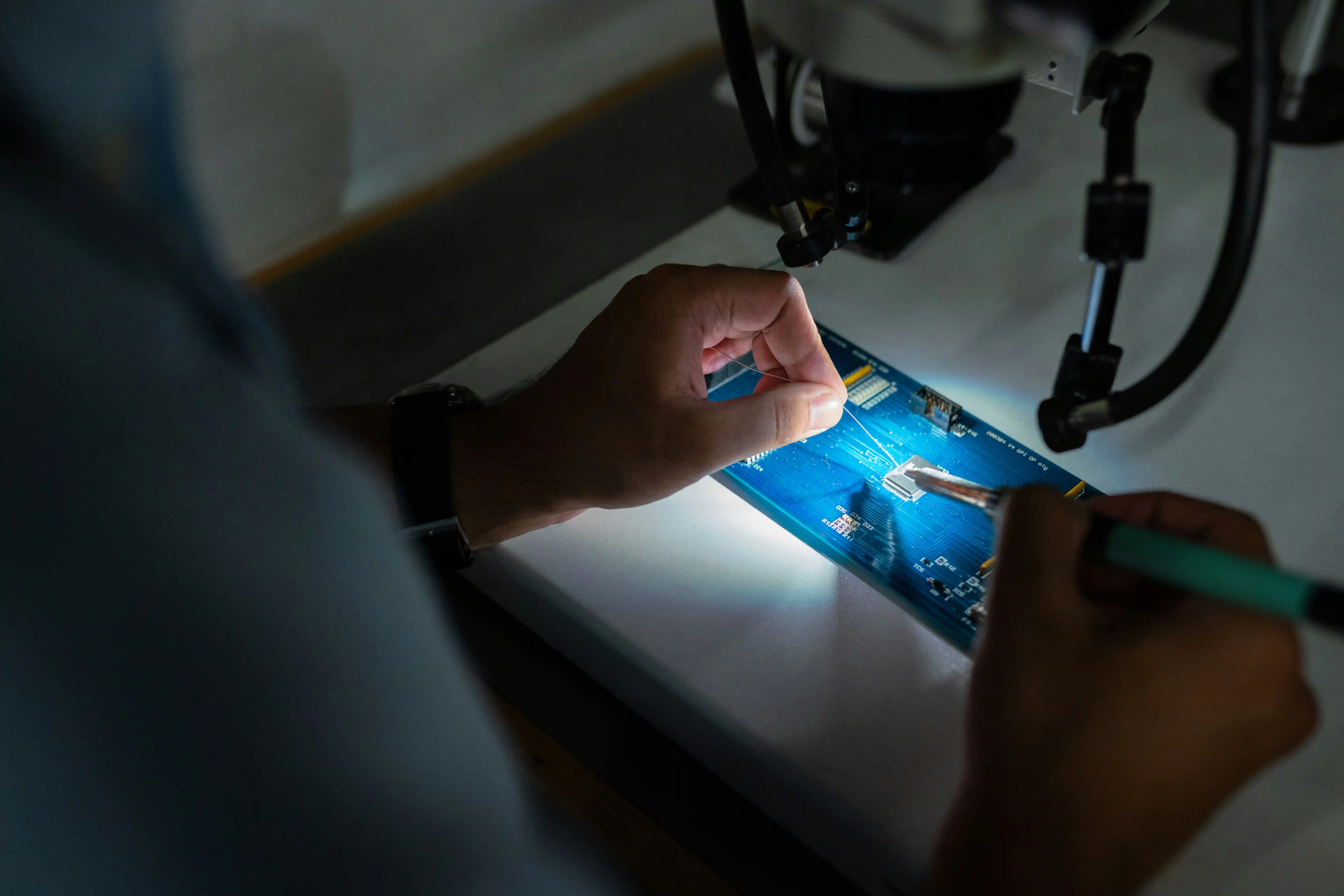 A chip is welded into a mobile device motherboard
