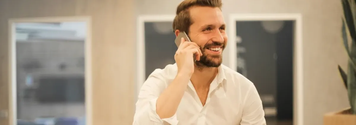 Mobile Device Strategy - Man making a telephone call from a hotel room