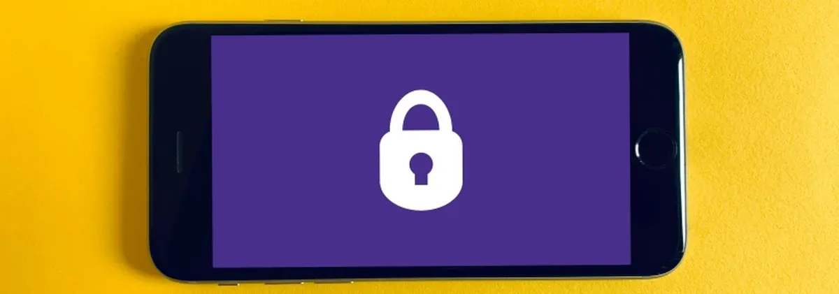 eSIMs and cybersecurity - a mobile phone against a yellow background displaying a lock icon