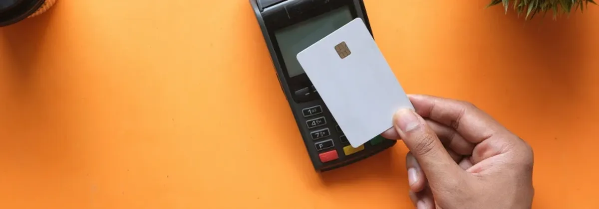 Real Cost of Digital Fragility - a contactless card transaction against an orange background